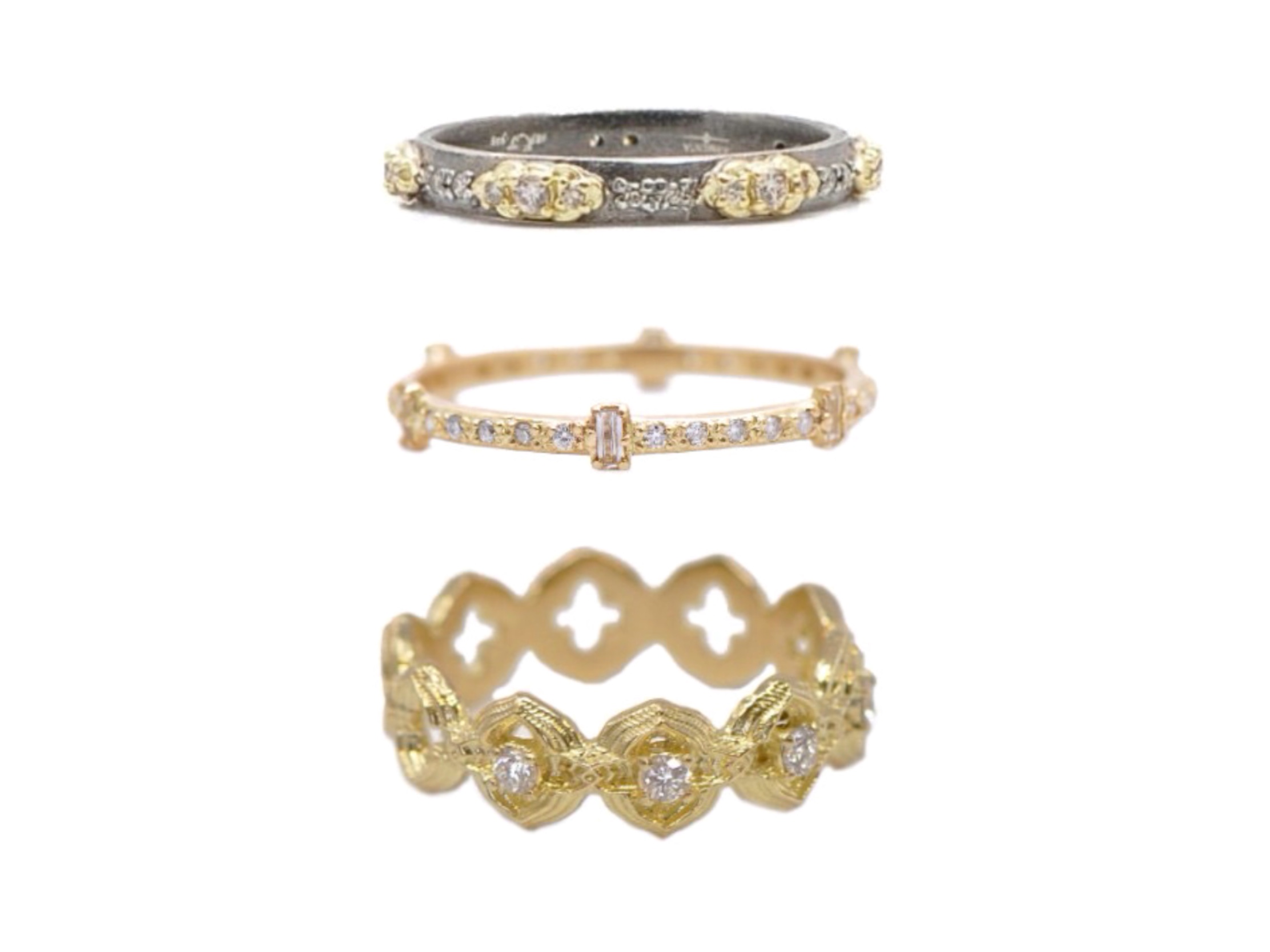 Three rings out of Armenta’s stackable band collection: The Mini Scroll Stack Band Ring, the Baguette Stack Band, and the Scroll Diamond Stack Ring by Armenta and available at Deutsch Fine Jewelry in Houston, Texas.