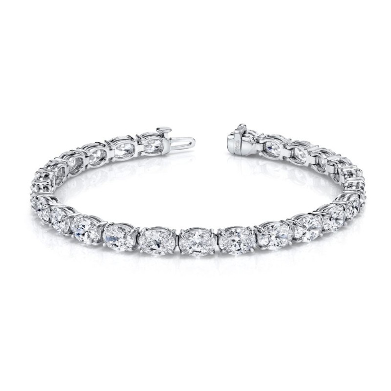 Norman Silverman Oval-Cut Diamonds Set In An East-West Platinum 4-Prong Bracelet.